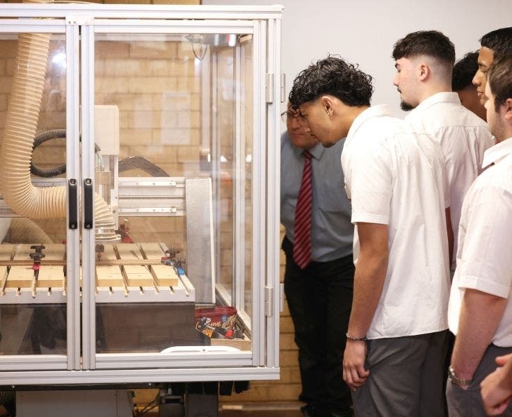Senior students using the Computer Numerically Controlled (CNC) router