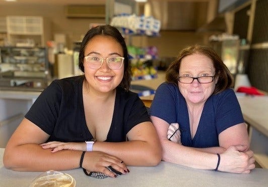 Photo of 2 members of the canteen staff